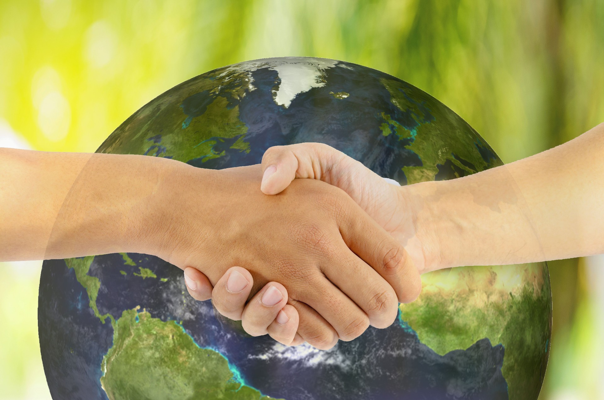 two man hand shaking with earth background, Elements of this image furnished by NASA